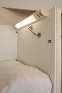 Ein Bett oder Betten in einem Zimmer der Unterkunft Albergue The Last Stamp