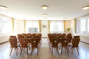 a room with a row of chairs and a podium at The Conscious Farmer Bed and Breakfast Sauerland in Willingen
