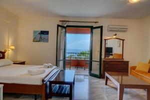 Postel nebo postele na pokoji v ubytování Magda Hotel Apartments