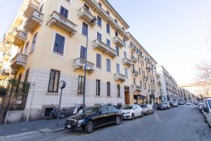 a car parked in front of a building at B&B Liberty Suite Milan in Milan