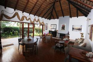 a living room with a couch and a table at House on Westcliff in Hermanus