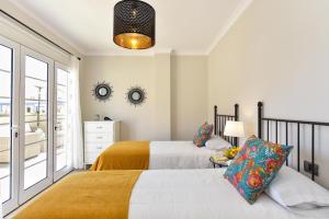 Posteľ alebo postele v izbe v ubytovaní Penthouse Daniela in Puerto Mogan IX