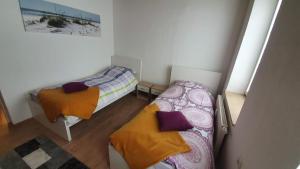 Ein Bett oder Betten in einem Zimmer der Unterkunft Zimmervervietung Bei Lachajczyk