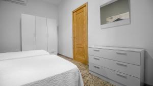 Łóżko lub łóżka w pokoju w obiekcie Casa de los Dragos