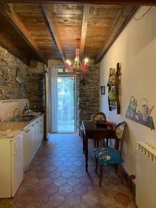 a kitchen with a table and a dining room at Affittacamere Le Terrazze in Corniglia