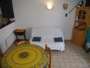 a room with a bed and a table in a room at Stephanie Immobilier in Saintes-Maries-de-la-Mer +63 photos