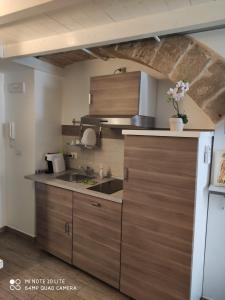 a kitchen with a sink and a counter top at B&B Sant'Anna in Bari