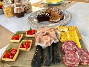 a plate of food with different types of food on a table at L’Orto di Rina in Numana