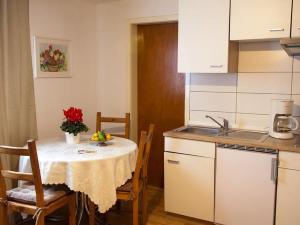 a kitchen with a table with a table cloth on it at Haus zur Bienenweide in Schömberg