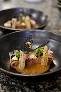 two plates of food on a table at Les Tanneurs in Namur