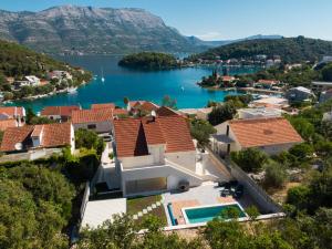 an aerial view of a house with a lake at WISH Apartments in Korčula