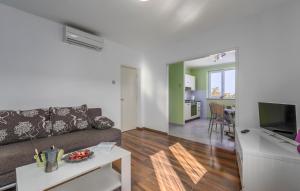 a living room with a couch and a table at Apartment Marino in Poreč