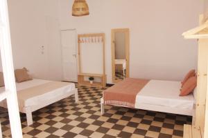 Postel nebo postele na pokoji v ubytování Casa de la Alegría