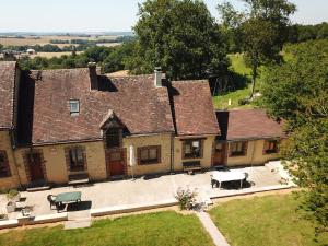 an aerial view of an old house with a patio at La Maison Lierue in Frétigny