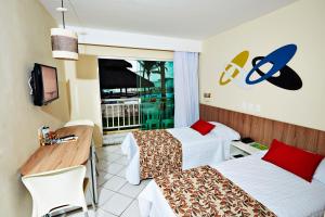מיטה או מיטות בחדר ב-Aram Natal Mar Hotel