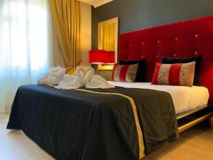 Postel nebo postele na pokoji v ubytování Veneza Hotel