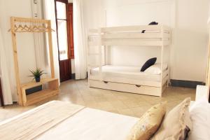 Postel nebo postele na pokoji v ubytování Casa de la Alegría