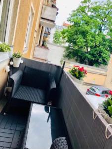 a view of a balcony with a couch on a building at Exclusive Maxvorstadt Studio in Munich