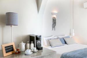 Llit o llits en una habitació de Blue Dolphins Apartments