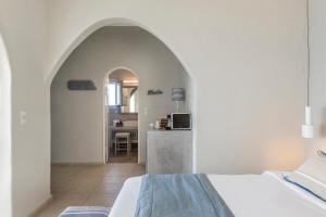Llit o llits en una habitació de Blue Dolphins Apartments