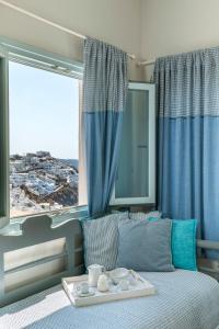 Llit o llits en una habitació de Blue Dolphins Apartments