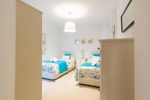 A bed or beds in a room at Victoria 50