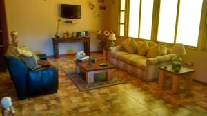 a living room with a couch and a table at Casa Pre-Cordillera Sexta Region in Rengo