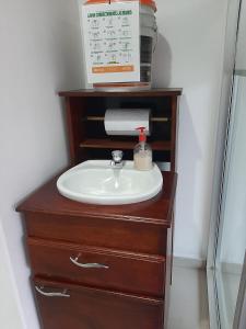 a bathroom sink sitting on top of a dresser at Hospedaje Tuuma in Fonseca