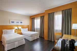 Cama ou camas em um quarto em INNSiDE by Meliá São Paulo ITAIM