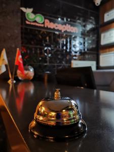 a gold cell phone sitting on top of a table at Beyond OTEL in Antalya