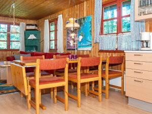 a dining room with a table and chairs at Three-Bedroom Holiday home in Toftlund 25 in Arrild