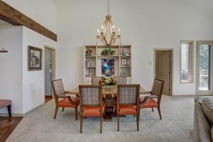 a dining room with a table and chairs at 2Br Condo In The Seasons At Arrowhead- Vaulted Ceilings Condo in Edwards