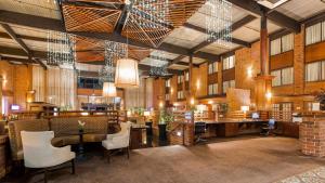 a large room with tables and chairs in a building at Best Western Premier the Central Hotel & Conference Center in Harrisburg