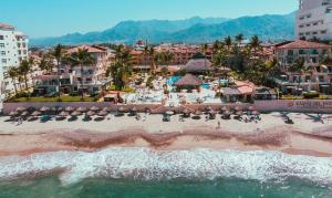 an aerial view of a beach at a resort at Canto del Sol Puerto Vallarta All Inclusive in Puerto Vallarta