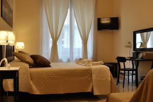 Postel nebo postele na pokoji v ubytování B&B Casa TORET