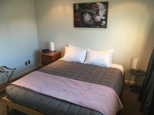 Postel nebo postele na pokoji v ubytování Kauri Motel on Riccarton