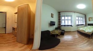 Postel nebo postele na pokoji v ubytování Penzion Heřmanice