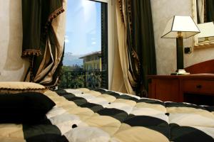 Postel nebo postele na pokoji v ubytování Hotel Columbia Wellness & Spa