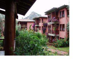 a building with flowers on the side of it at Sundia By Liberty Suncity in Oludeniz