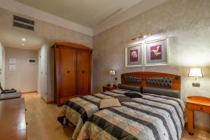 Postel nebo postele na pokoji v ubytování Hotel Columbia Wellness & Spa