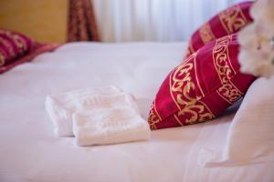 Postel nebo postele na pokoji v ubytování Hotel Villa Imperina