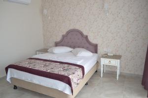 Postel nebo postele na pokoji v ubytování Turk Hotel