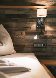 Postel nebo postele na pokoji v ubytování Hotel & Garni Das Köhle INKLUSIVE SUPER SOMMER CARD 2025