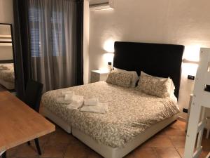 Posteľ alebo postele v izbe v ubytovaní B&B Il Viaggiatore