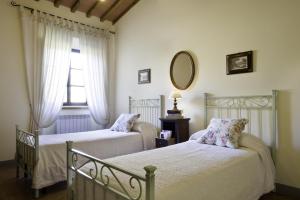Postel nebo postele na pokoji v ubytování Agriturismo L'Incrociata