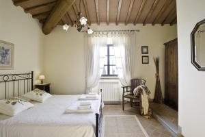 Postel nebo postele na pokoji v ubytování Agriturismo L'Incrociata