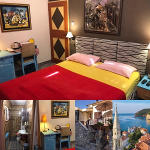 a hotel room with a king sized bed and a picture of a castle at Casa SERGIO Budva Rooms & Apartments in Budva