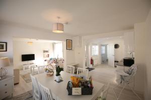 a kitchen and living room with a table and chairs at The Annexe in Ditcheat in Ditcheat