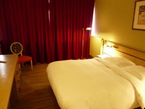 Katil atau katil-katil dalam bilik di Hotel Olivier