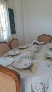 a table with plates sitting on top of it at Rosewood Estate in Chail